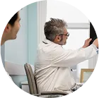 Doctor performing checkup on male patient